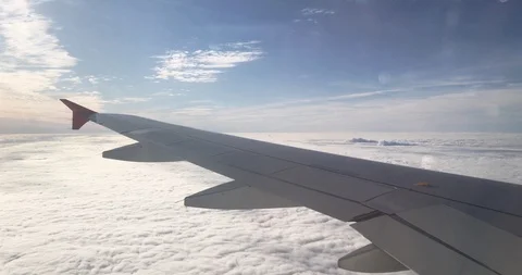 View of wing and engine airplane over thick layer of cloud. Video stock 117442535