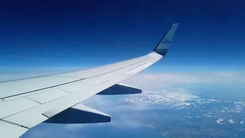 View of a wing of a KLM airplane while flying. Amsterdam Stock Footage 201488916