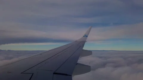 View of a wing of a KLM airplane while flying. Amsterdam Stock Footage 201489020