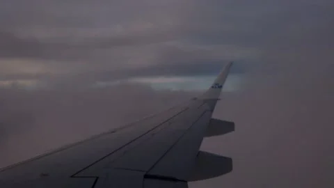 View of a wing of a KLM airplane while flying. Amsterdam Stock Footage 201489101