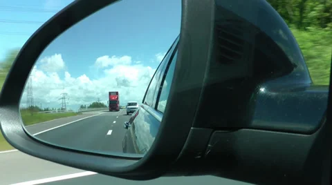 View from wing mirror reflection of cars and lorrys going down the M6 Motorway Stock Footage 39650770