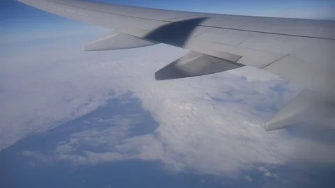 A view of the wing of the plane above the clouds. Stock Footage 78505361