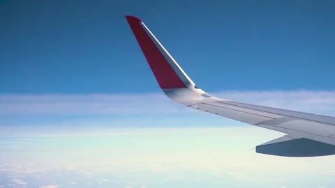 View of the wing of the plane and the sky Stock Footage 130658826