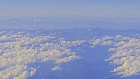 View a wing a plane flying above. Stock Footage 284100658