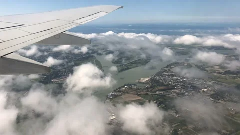The View of the Wing of The Plane Flying over the Clouds 스톡 동영상 130404587