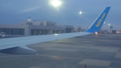 View of The Wing through the Airplane Porthole Stock Footage 129196879