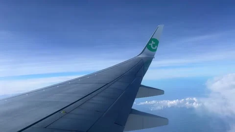 View of a wing of a Transavia airplane while flying. Stock Footage 220221879