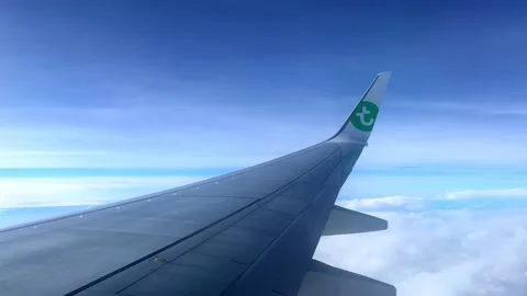 View of a wing of a Transavia airplane while flying. Stock Footage 220221902