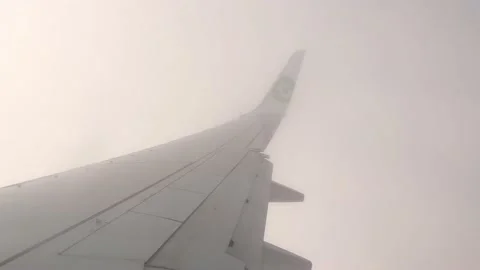 View of a wing of a Transavia airplane while flying. Stock Footage 220221909