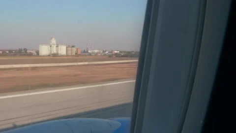 View of wing upper surface and engine intake of landed aircraf. Plane is moving Stock Footage 145831673