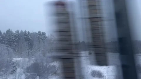 View of the winter forest landscape from the window of a moving train Stock-Footage 168428781