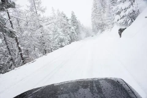 View of winter landscape with snow and snowcapped trees and peaks Stock Photos