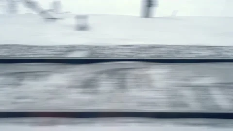 View in winter of the railway in the snow through train window moving fast Stock Footage 168675443