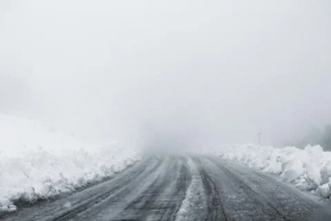 View on winter road during bad weather conditions Stock Photos