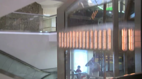 View from within elevator as it ascends in mall (1 of 2) Stock Footage 32327058