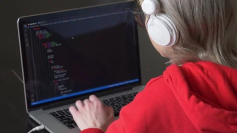 View as woman in glasses working with code on laptop computer. Stock Footage 150616438