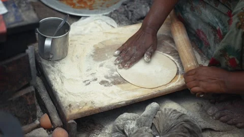 View of a woman rolling dough for flatbread in Bogura, Bangladesh. 스톡 동영상 335552263