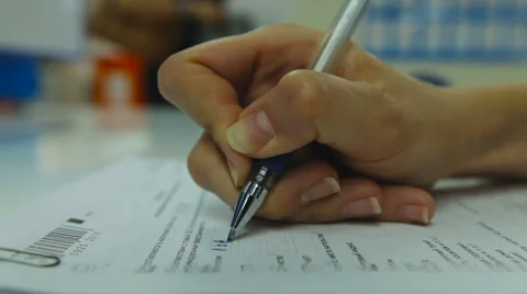 View of Woman's Hand Neatly Complete a Form Print. Woman Writes With a Pen. Stock Footage