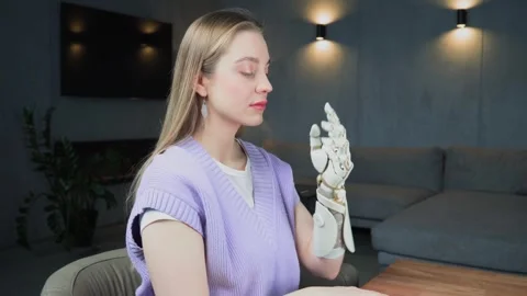 View of a woman's hand with a sleek, attractive looking prosthetic arm Stock Footage 257002903