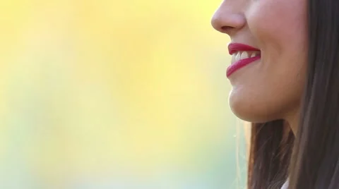 View of woman's mouth with red lipstick, smiling and singing with microphone Stock Footage 59556643