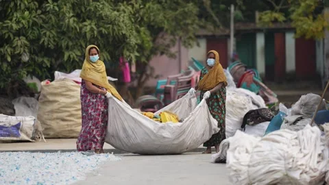 View of women sorting plastic waste in Jashore, Bangladesh. Video stock 335465027