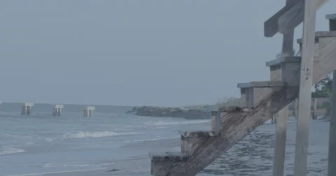View of Wooden Dock's Steps with Damaged Dock in distance next to shore. Slog3 Stock Footage 67549447