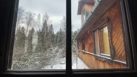 View from the wooden window to the snow-covered forest Stock Footage 233082181
