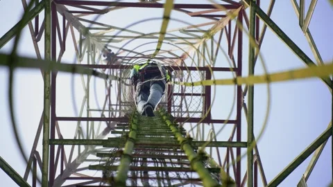 View of a worker climbing a telecommunications tower, Bangladesh. Stock Footage 335561647