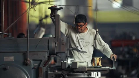 View of a worker operating industrial machinery in Bogura, Bangladesh. Video stock 334950087