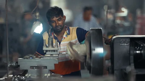 View of a worker operating industrial machinery in Bogura, Bangladesh. Video stock 334950166