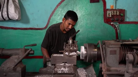 View of a worker operating a lathe machine in a workshop, Bangladesh. Video stock 334950351