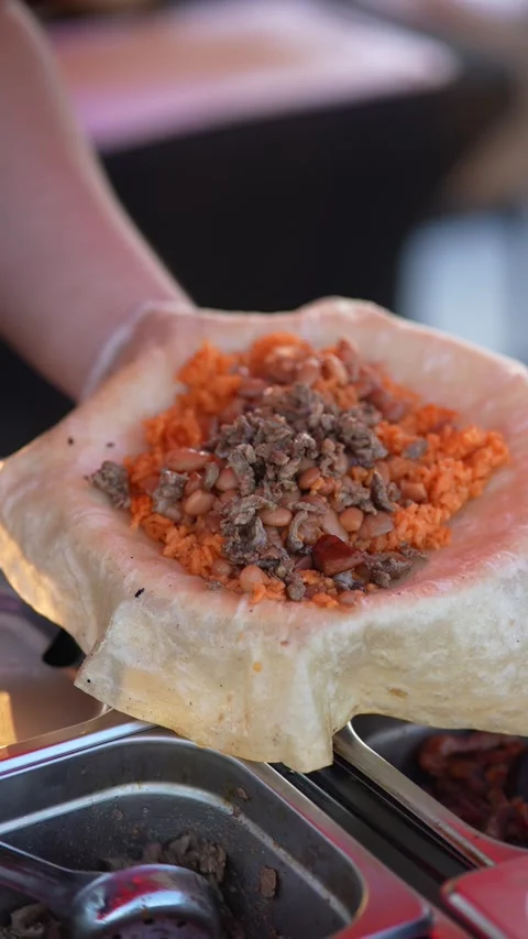 View of a worker preparing a burrito in a food truck, United States. Stock Footage 343683815
