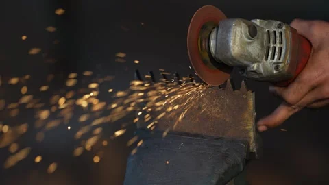 View of a worker using an angle grinder on metal in Bangladesh. Video stock 334951563