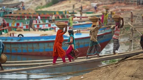 View of workers carrying baskets at Aminbazar, Bangladesh. Video stock 334994044