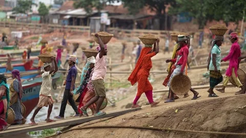 View of workers carrying baskets at Aminbazar, Bangladesh. Stock Footage 334994103