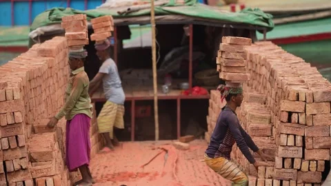 View of workers carrying bricks on their heads at Aminbazar, Bangladesh. Video stock 334993659