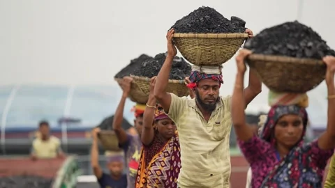 View of workers carrying coal baskets in Aminbazar, Bangladesh. 스톡 동영상 334992587