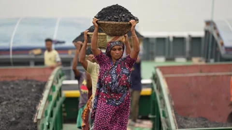 View of workers carrying coal baskets at Aminbazar, Bangladesh. Video stock 334992640
