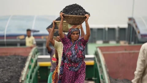 View of workers carrying coal baskets in Aminbazar, Bangladesh. Stock Footage 334992690