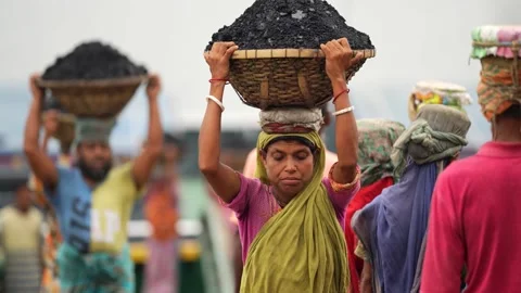 View of workers carrying coal baskets in Aminbazar, Bangladesh. Video stock 334992738