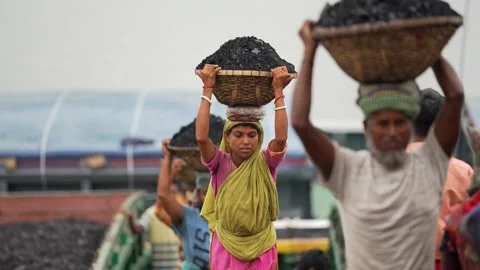 View of workers carrying coal baskets at Aminbazar, Bangladesh. Video stock 334992789