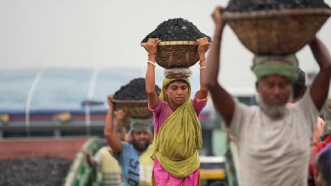 View of workers carrying coal baskets at Aminbazar, Bangladesh. Video stock 334992904