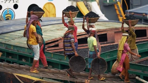 View of workers carrying coal baskets at Aminbazar, Bangladesh. Video stock 334992963