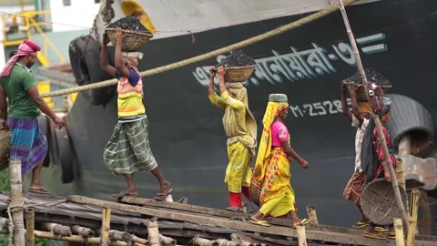 View of workers carrying coal baskets at Aminbazar, Bangladesh. Video stock 334994198