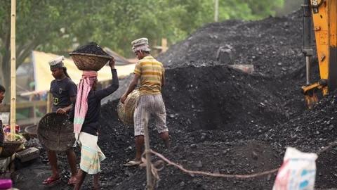View of workers carrying coal baskets in Aminbazar, Bangladesh. Stock Footage 334994600