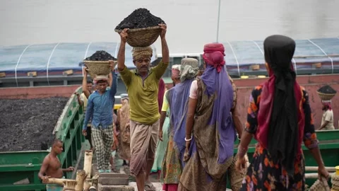 View of workers carrying coal baskets at Aminbazar, Bangladesh. Stock Footage 334995211