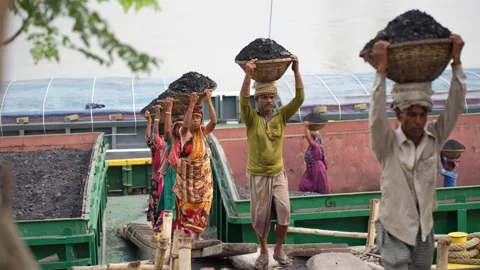 View of workers carrying coal baskets at Aminbazar, Bangladesh. 스톡 동영상 334995525
