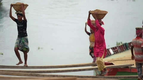 View of workers carrying sand baskets at Aminbazar, Bangladesh. Video stock 334993354