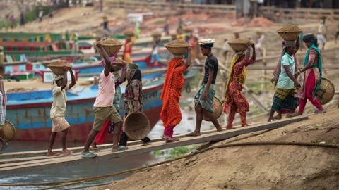 View of workers carrying sand baskets at Aminbazar, Bangladesh. Video stock 334994117