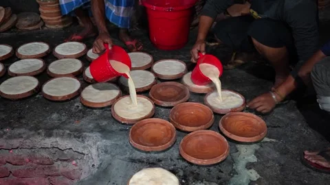 View of workers making traditional curd in Bogura, Bangladesh. Stock Footage 336425812